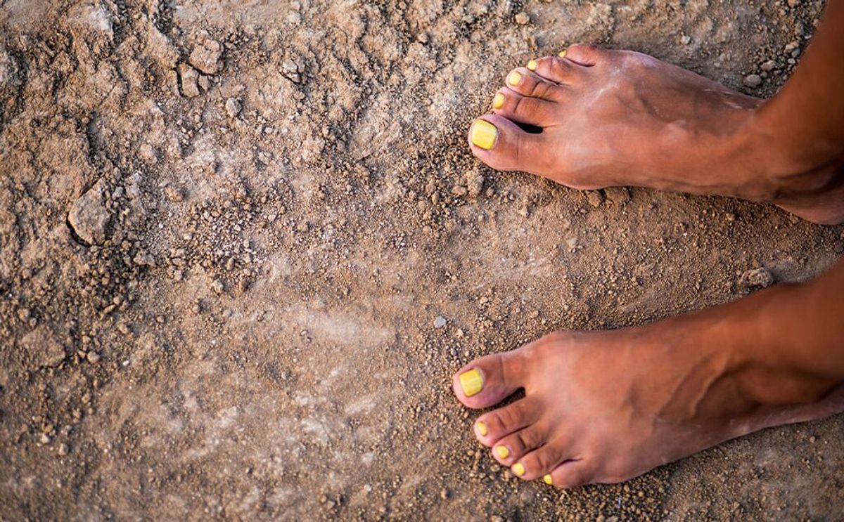 Bare feet touching the earth